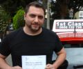 Tony with Driving test pass certificate